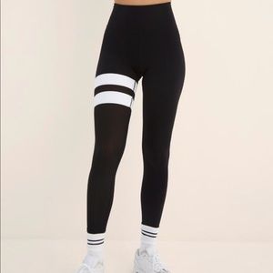 Body Language black leggings with white stripes and mesh leg